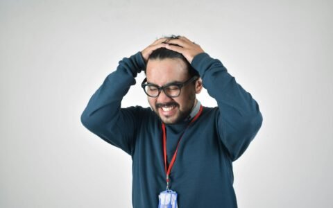 man in bluee ssweater